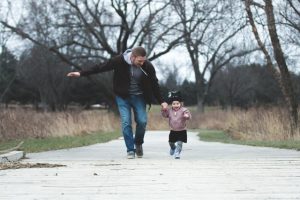 Father running with child